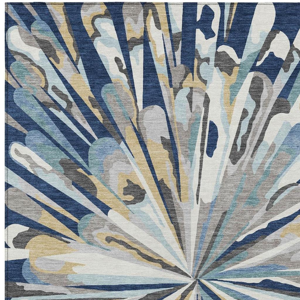 Navy blue abstract area rug with radial fan pattern, cream and aqua accents