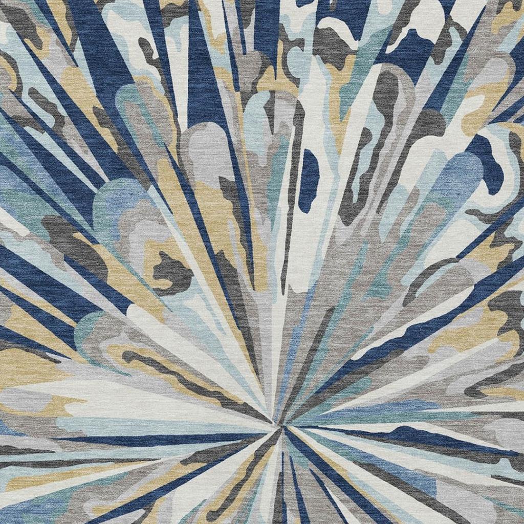 Navy blue abstract area rug tight view of sunburst rays in cream, aqua, and gold