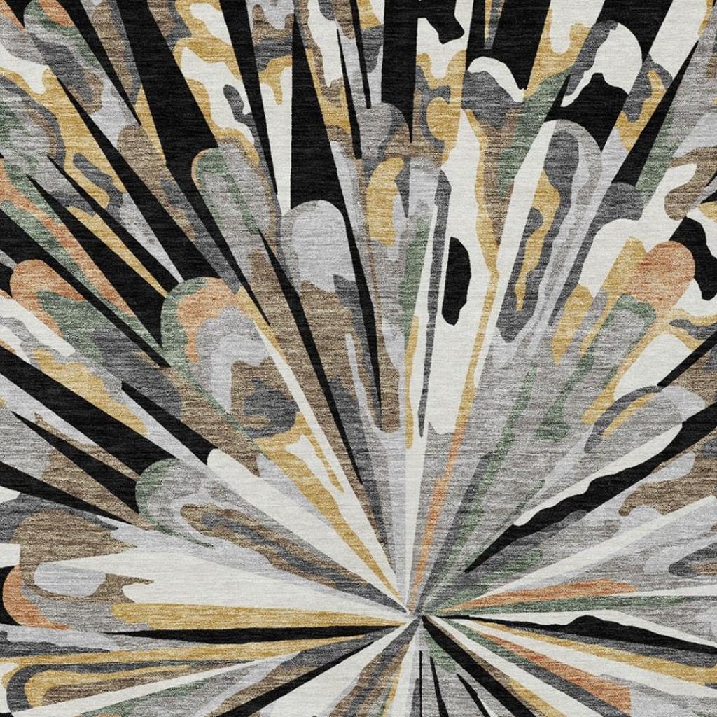 Abstract starburst area rug with dark outer rays and multicolor brush accents