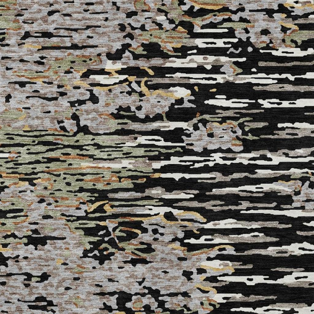 Top view of abstract striped area rug with speckled light and dark sections