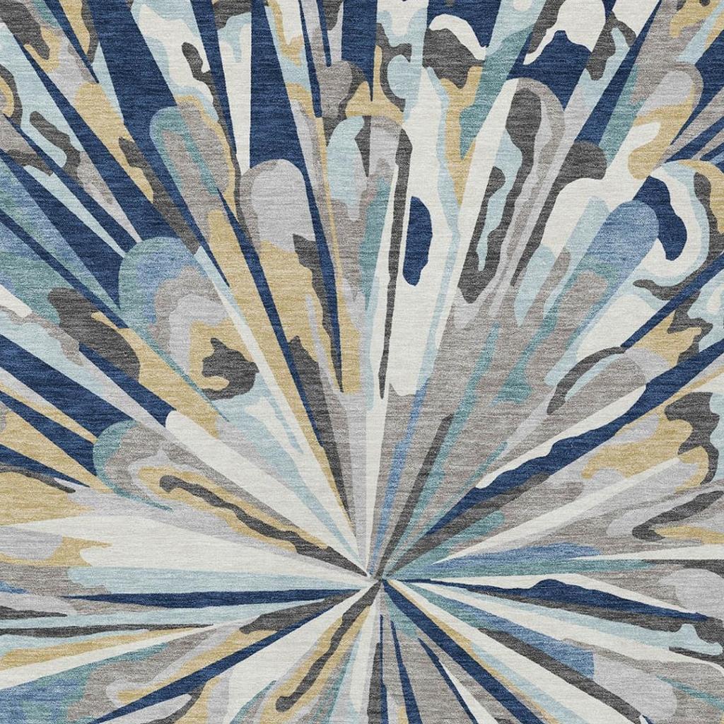 Navy and light blue abstract sunburst area rug with distressed radial pattern
