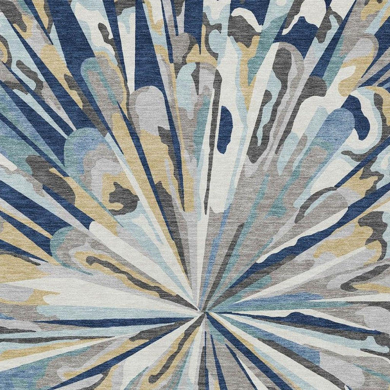 Navy and light blue abstract sunburst area rug with distressed radial pattern