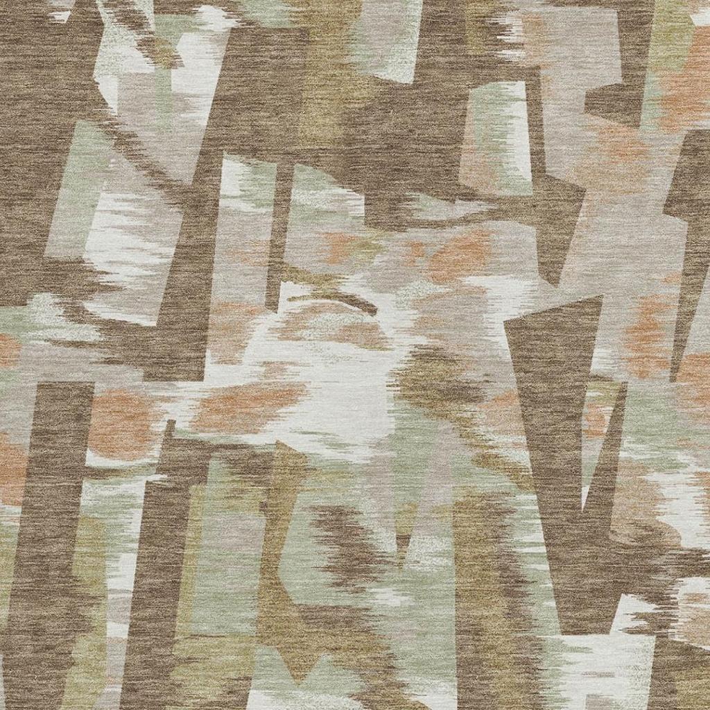 Abstract area rug close-up showing brown, beige, and light greenish geometric blocks.