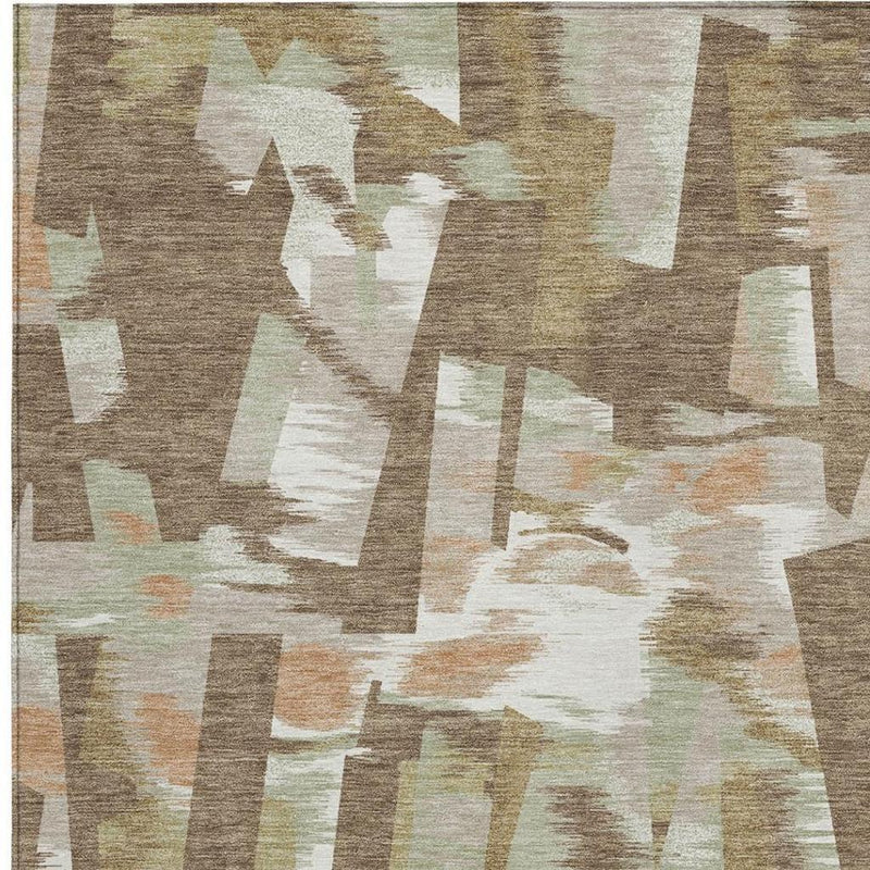 Abstract rug close-up with brown and beige overlapping block shapes; flat woven texture.