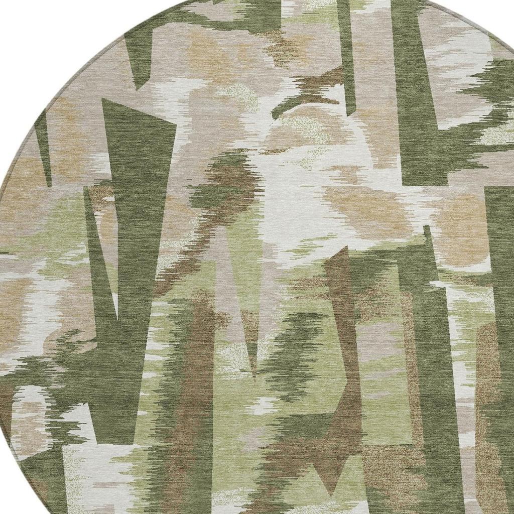 Round abstract area rug close-up with olive green and cream textured block shapes