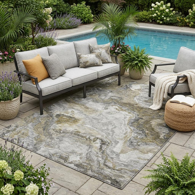 Abstract wash area rug with gray and beige mottled pattern on patio