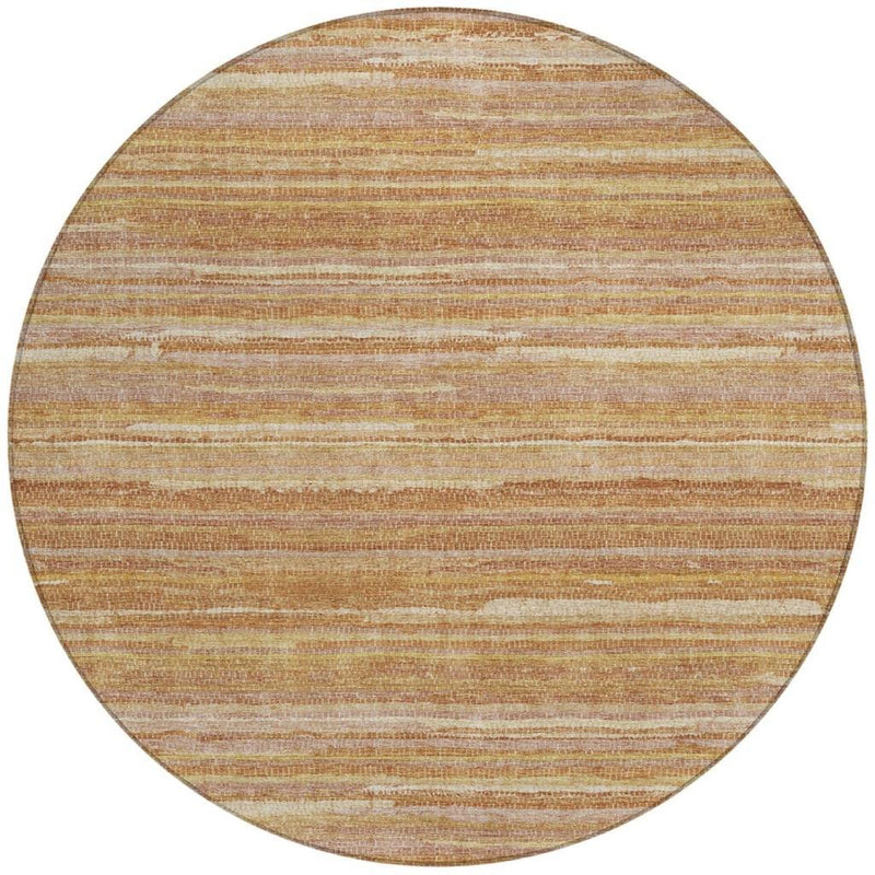 Round washable area rug with orange and copper horizontal stripes over a cream base