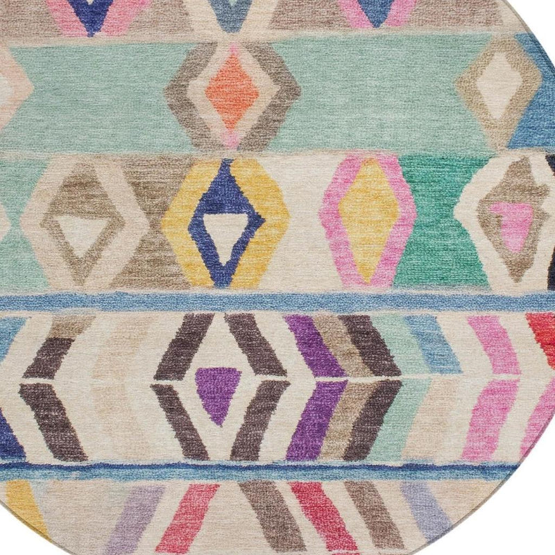 Round area rug section with mint green background, colorful diamond motifs, and zigzag bands