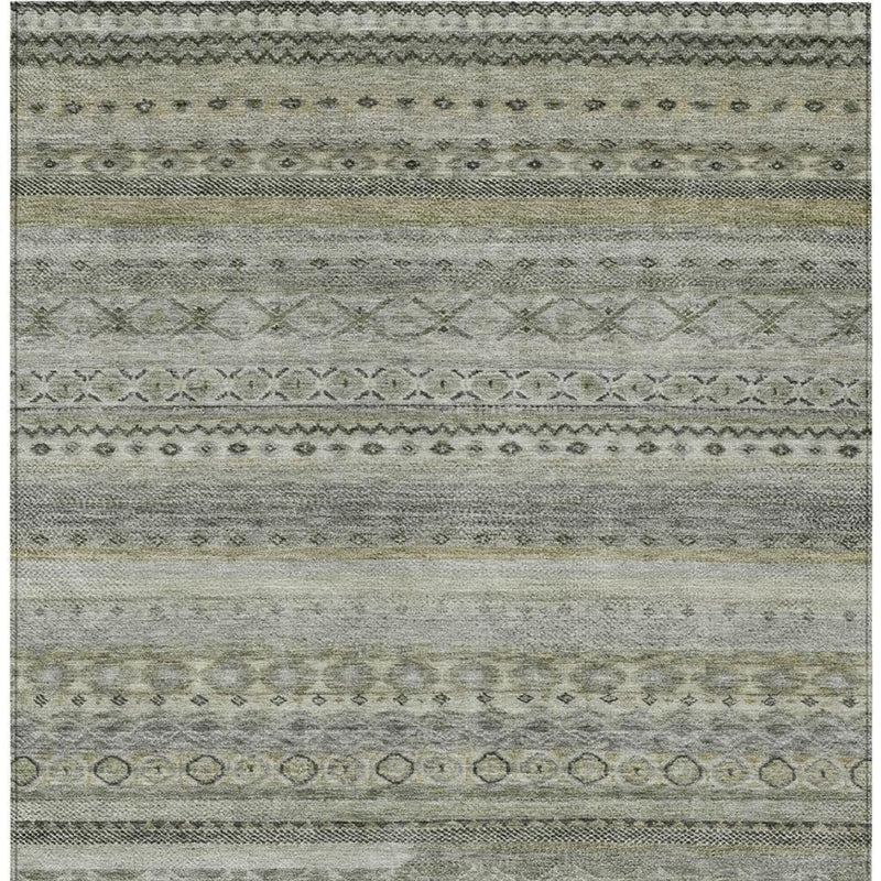 Full view of gray and pewter striped washable rug with ornate center bands
