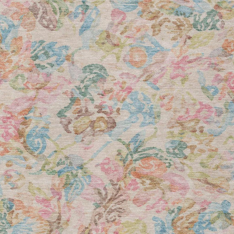 Floral area rug surface with speckled texture and pastel blue, pink, green, tan motifs