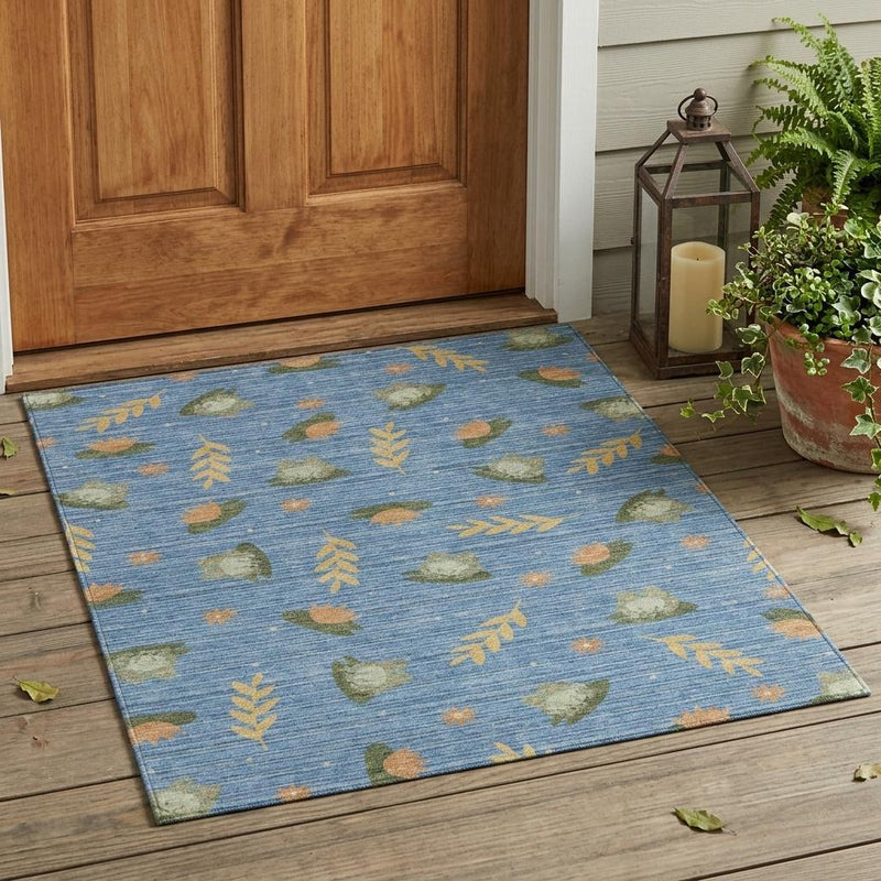 Blue botanical leaves area rug with border edges; olive and tan leaf pattern