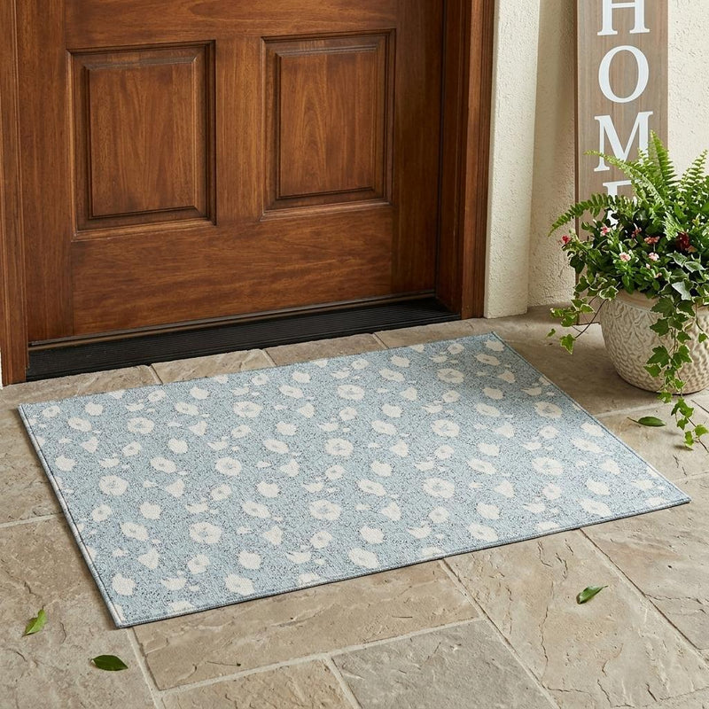 Rectangular sky blue indoor outdoor area rug with light-blue floral motifs