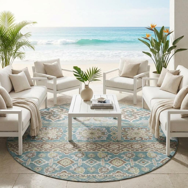 Round area rug with teal and beige floral medallion design in living room setting