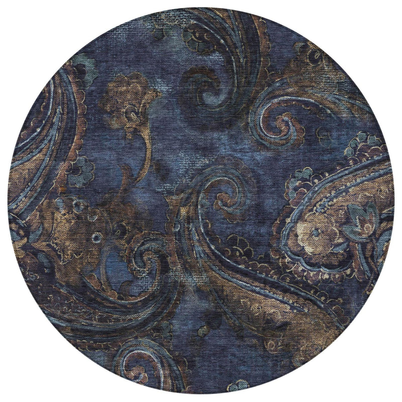 Round paisley area rug, navy blue with detailed beige scrolls and teal accents.