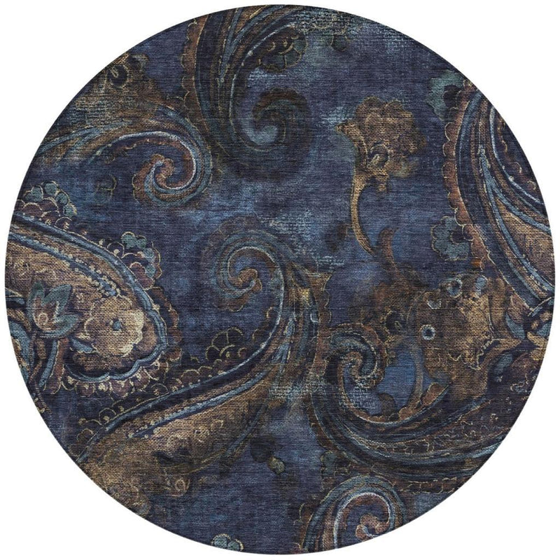 Round paisley area rug, navy blue with beige scrollwork and teal highlights (detail).