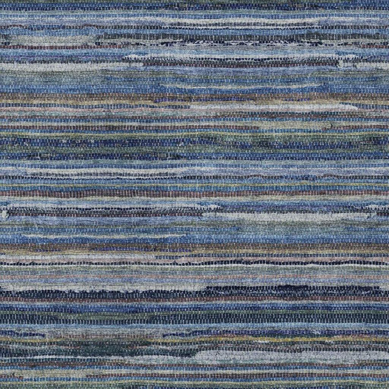 Blue and gray striped rug close-up with layered horizontal bands