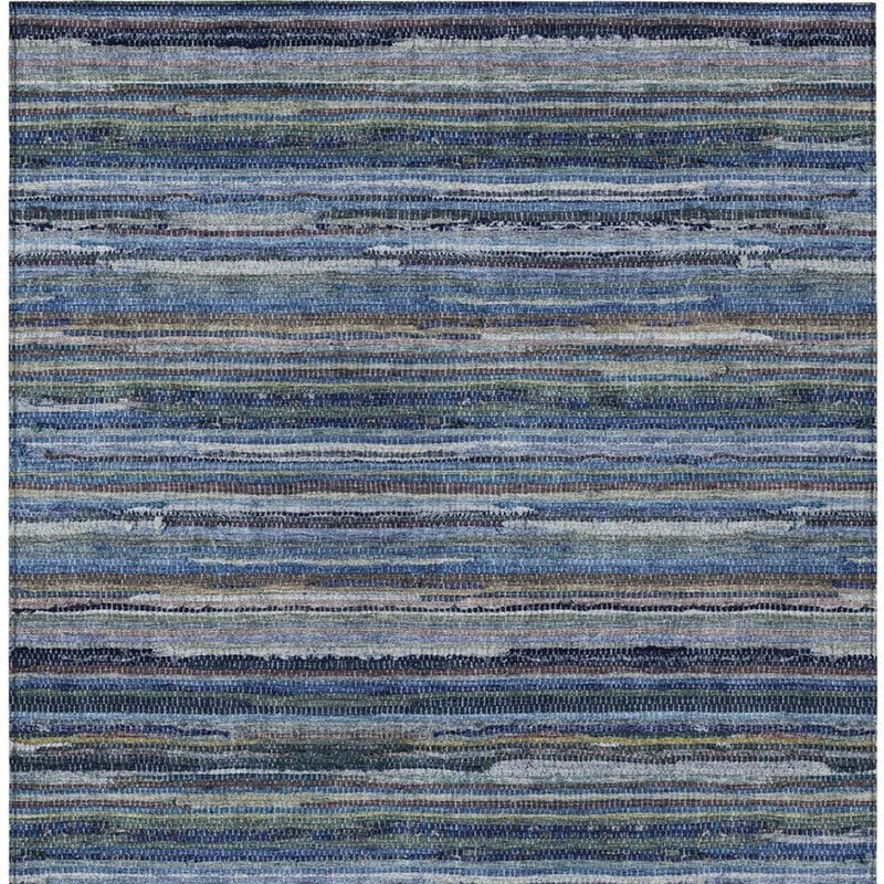 Close-up of blue and gray striped rug with speckled woven texture