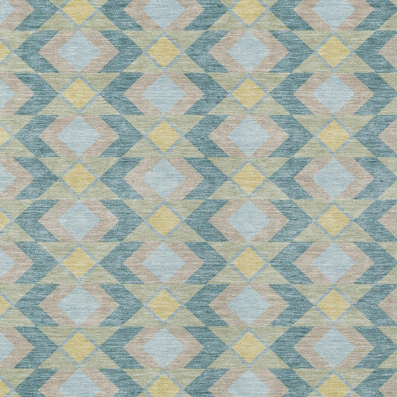 Pattern detail of teal blue geometric area rug with cream, yellow, and gray blocks