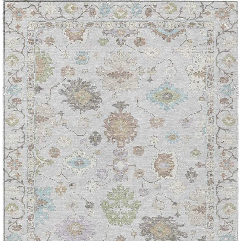 Rectangular rug with light background and multicolor oriental design, framed by detailed border