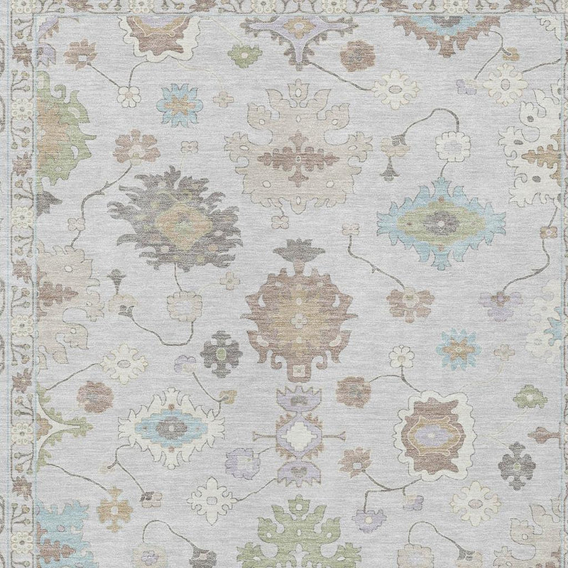 Light gray oriental area rug close-up with colorful geometric floral motifs