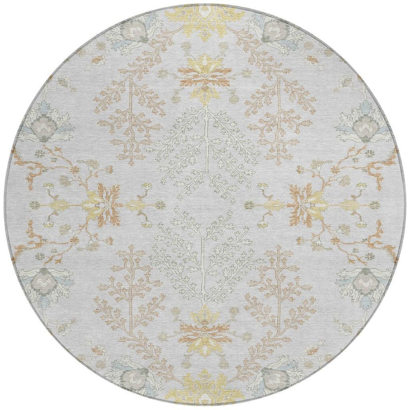 Round area rug close view with light gray weave and ivory floral damask accents