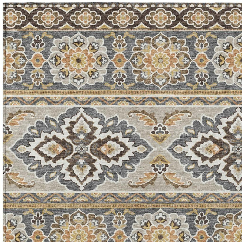 Gray and ivory tribal area rug close-up with large floral medallions and swirls