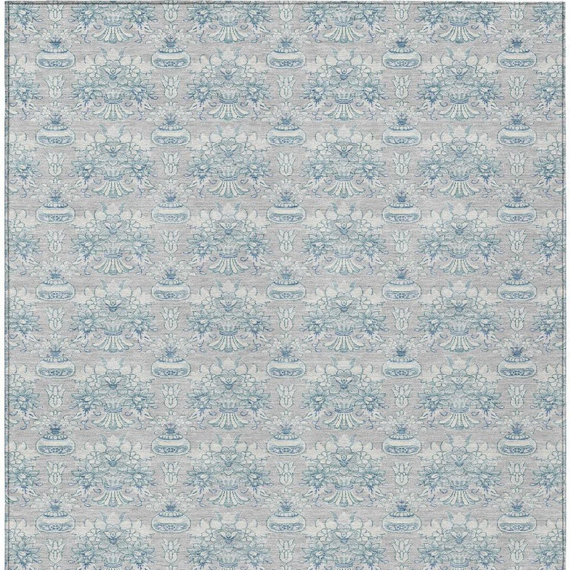 Indoor outdoor area rug, full view, light gray base with blue floral ornament pattern