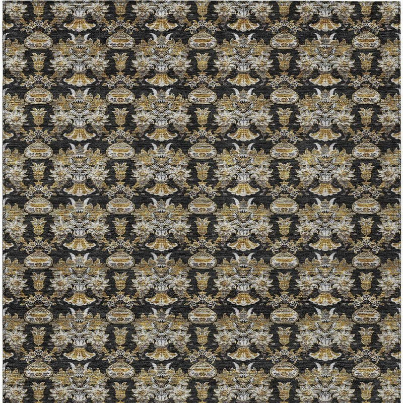 Area rug with black background and dense gold and cream floral vase medallion motif
