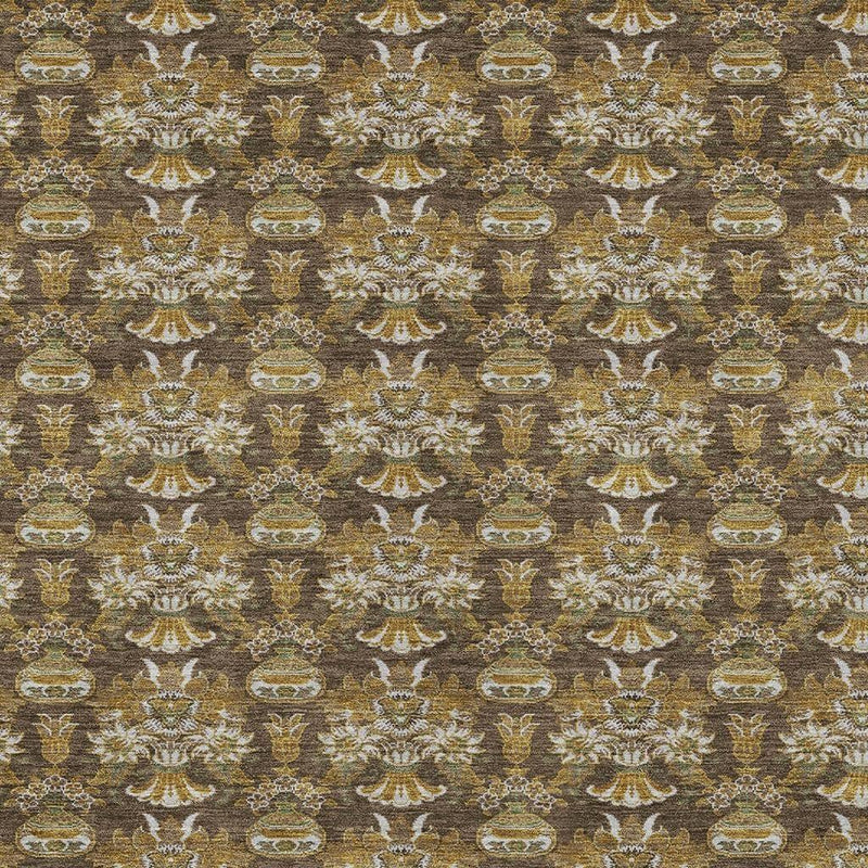 Close-up of floral damask pattern area rug in brown, gold, and off-white