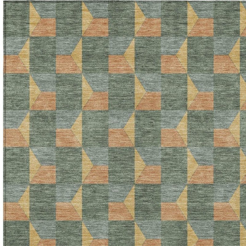 Geometric area rug close-up with green-gray texture and orange, yellow block pattern