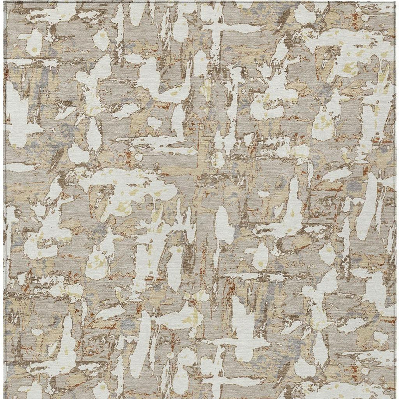Beige and gray abstract area rug with large distressed motif texture.