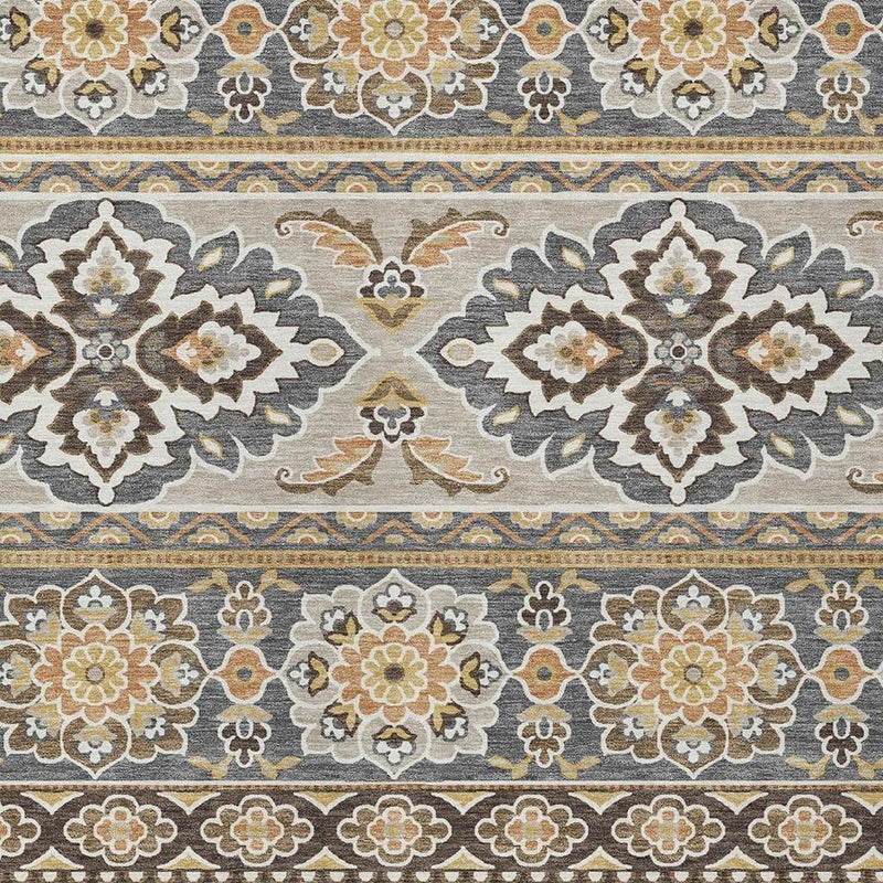 Gray and ivory patterned area rug with repeating floral and geometric bands