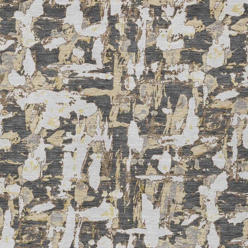 Abstract area rug close-up with textured, distressed graphite and ivory pattern.