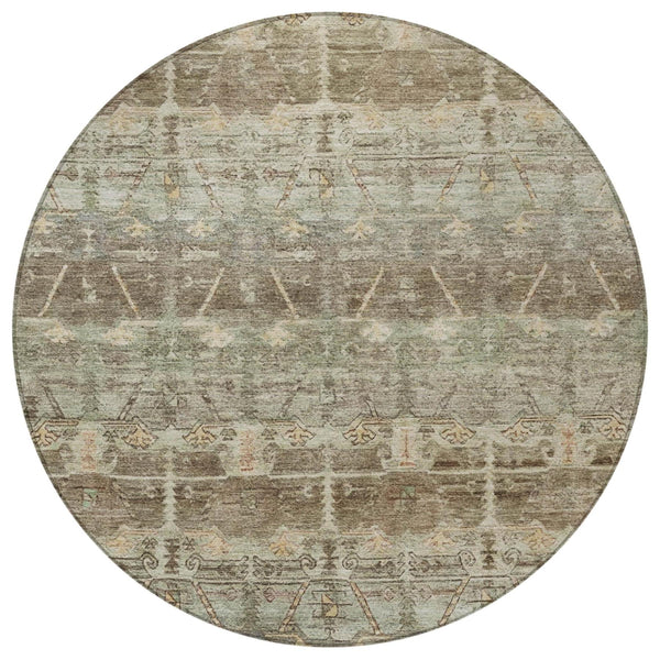 Round area rug with faded tribal pattern in beige, gray, and brown tones