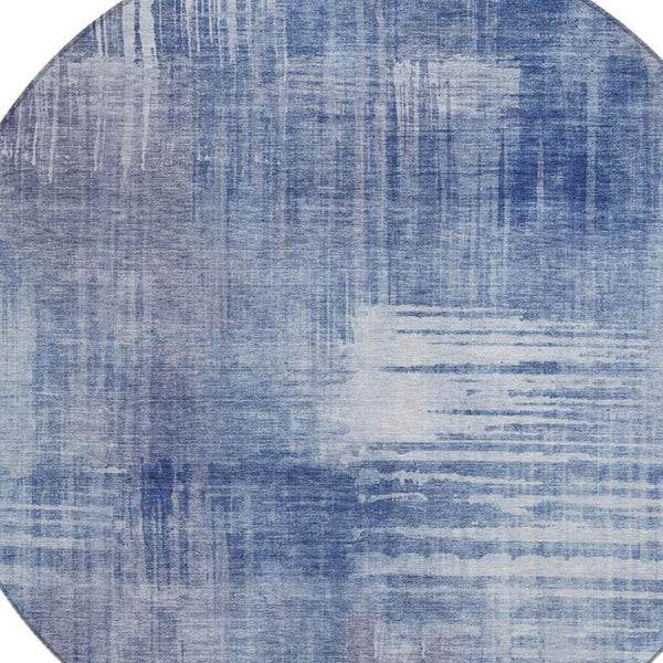Round blue abstract area rug with distressed horizontal and vertical pattern