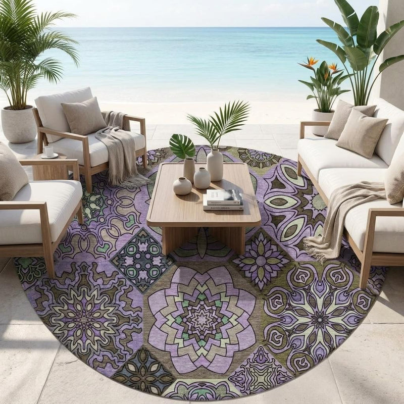 Round patchwork area rug with purple and graphite medallion pattern