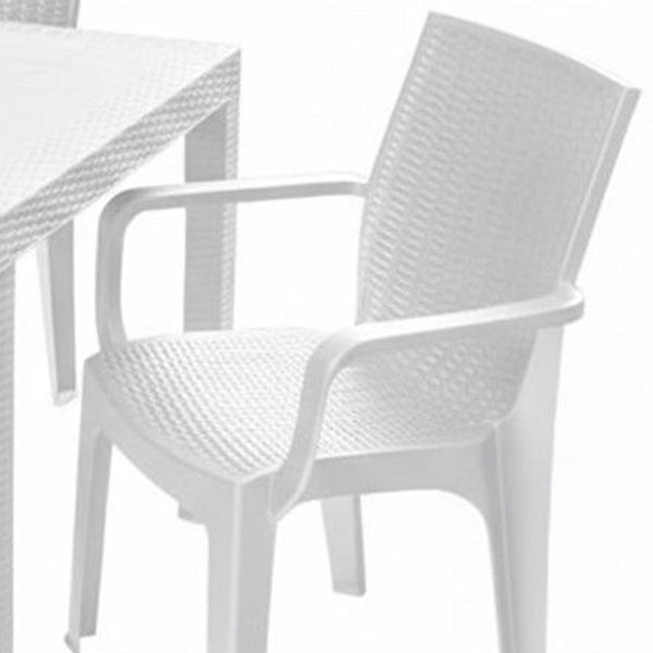 White plastic patio chair with woven-style backrest and armrests, next to table