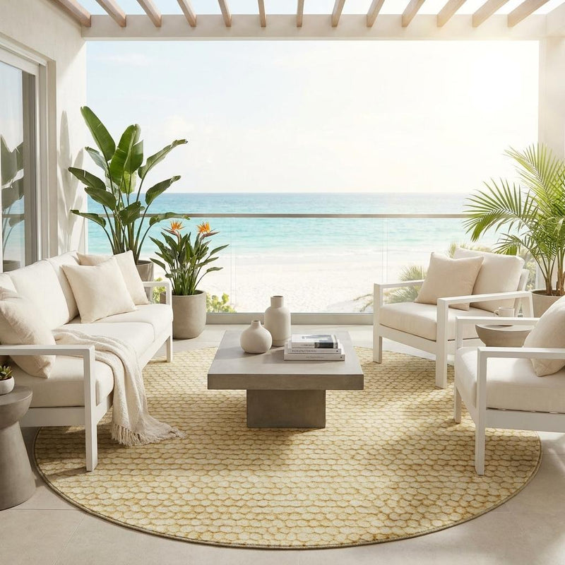 Round gold-and-wheat textured area rug on indoor floor