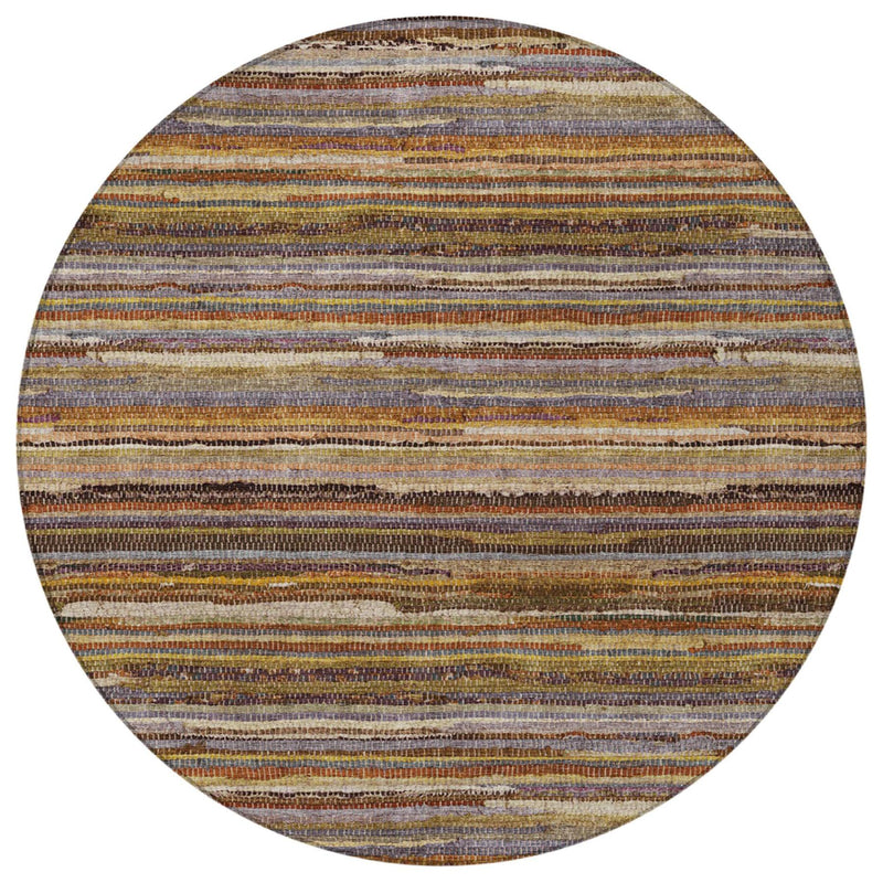 Round area rug close-up with thin horizontal stripes in orange, brown, blue, and cream
