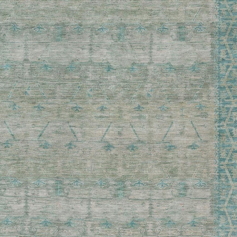Teal blue and pewter tribal area rug close-up, distressed geometric motif