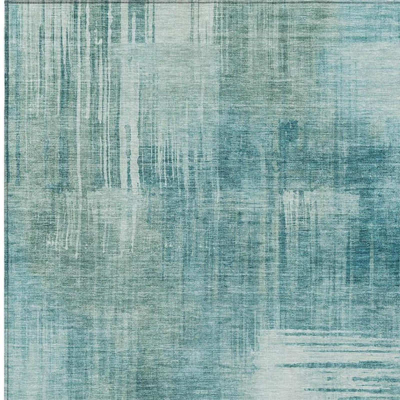 Teal blue abstract area rug close-up with vertical and horizontal brush textures