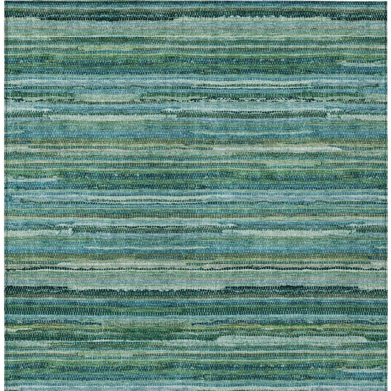 Teal and green striped area rug with solid border edge and mottled texture