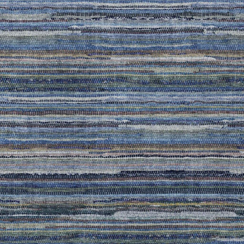 Close-up of blue and gray striped woven area rug with flat stripe pattern