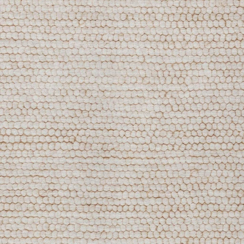 Ivory area rug close-up with small looped pile and faint striped lines