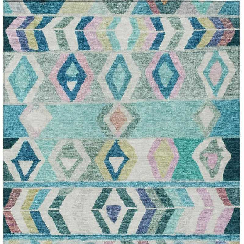 Teal and turquoise tribal area rug close-up with repeating diamond and chevron motifs.