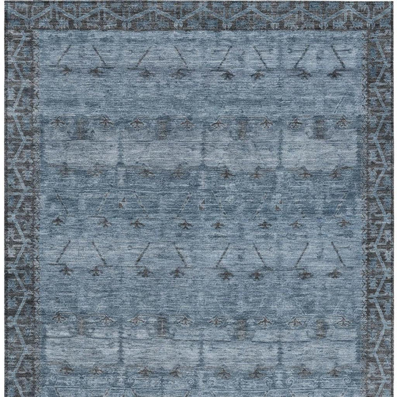 Blue and gray tribal area rug with repeating geometric motifs and border edging