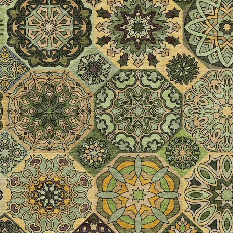 Indoor/outdoor area rug close-up of patchwork medallions in green, olive, and tan