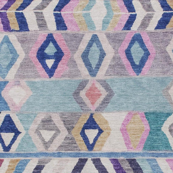 Close-up of blue, aqua, purple, and pink tribal geometric rug pattern
