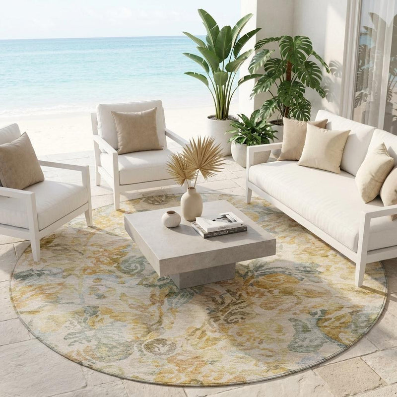 Round floral rug with cream base, gold and gray-blue pattern in an indoor/outdoor setting