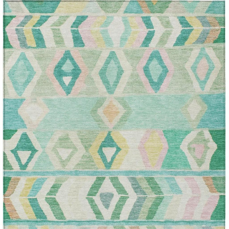 Turquoise and teal tribal area rug close-up with diamond motifs and chevron bands